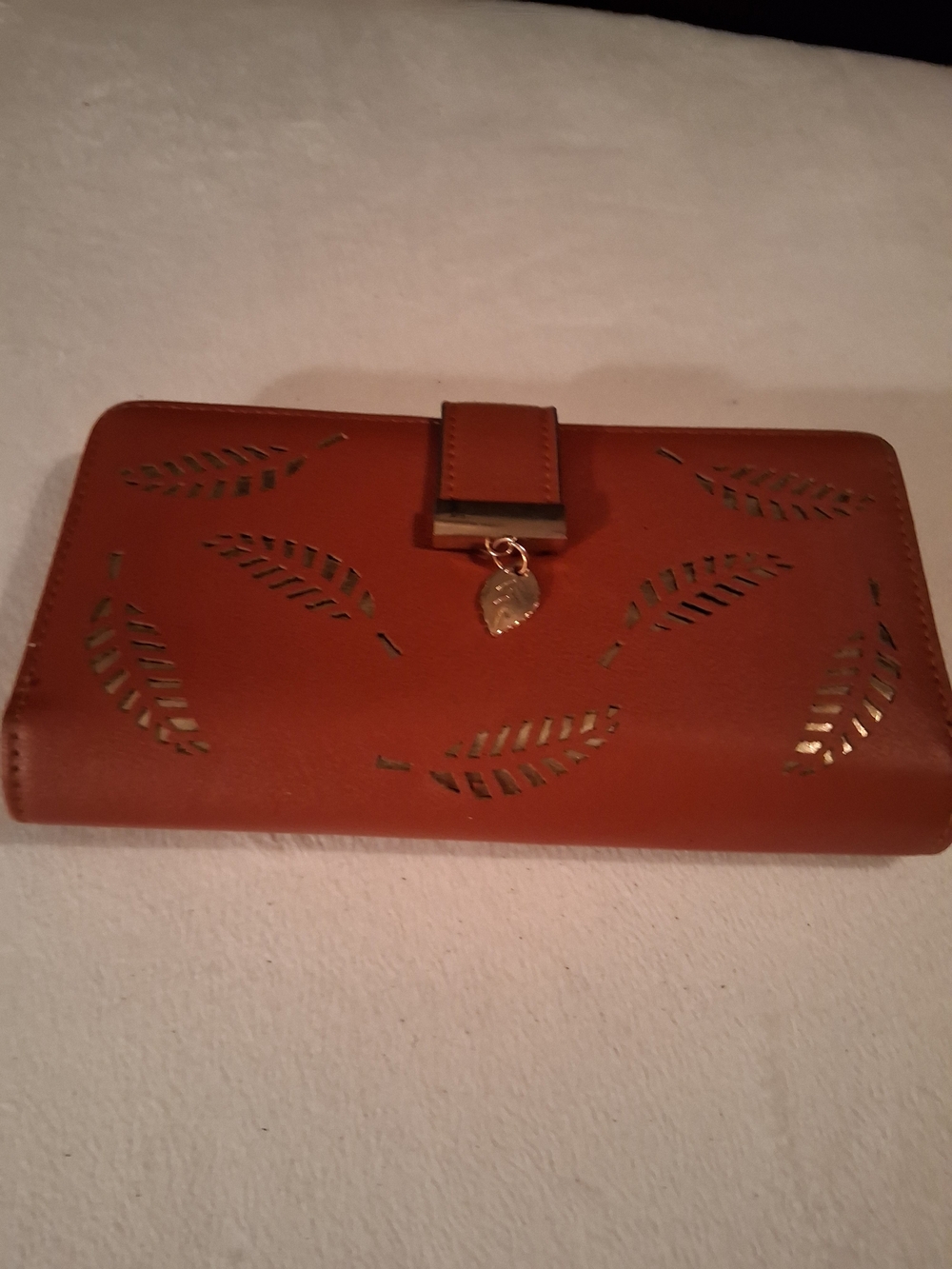 Women’s Tan Leaf-Cut Clutch Wallet with Gold Charm